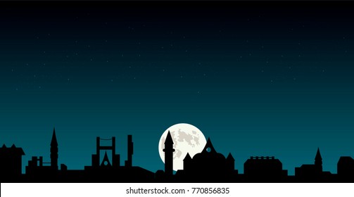night starry sky over dark city silhouette. old victoria style buildings,full moon