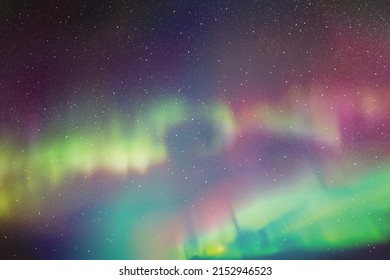 Night starry sky and polar lights. Purple green aurora borealis