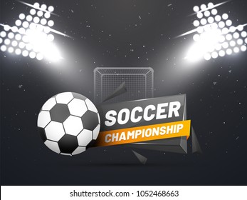 Night view of a soccer ground with flud lights, goal net and soccer ball.