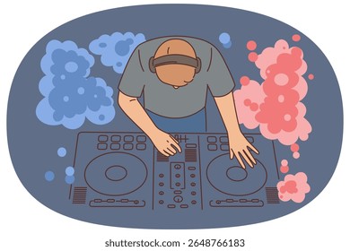 Nightclub DJ uses mixing console to play music from vinyl records to party goers. DJ guy with musical equipment to create energetic tracks during dance festival or disco in entertainment club