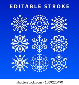 Nine snowflakes of different shapes on a blue background. Editable stroke