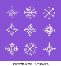 Nine white snowflakes in a square on a blue background.
