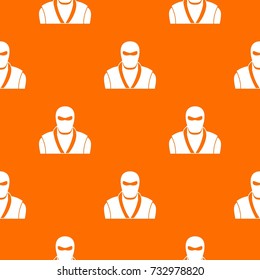 Ninja in black mask pattern repeat seamless in orange color for any design. Vector geometric illustration