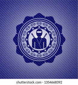 ninja icon inside badge with denim background