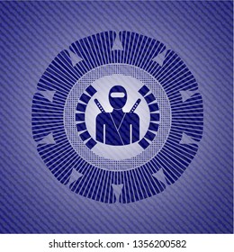 ninja icon inside badge with denim texture