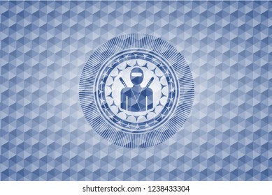 ninja icon inside blue polygonal emblem.