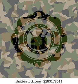 ninja icon inside camouflaged emblem. 