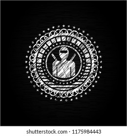 ninja icon inside chalkboard emblem written on a blackboard