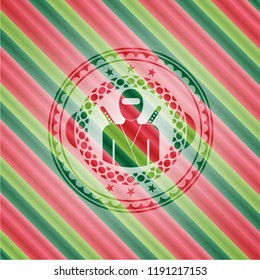 ninja icon inside christmas colors badge.