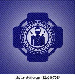 ninja icon inside emblem with denim high quality background