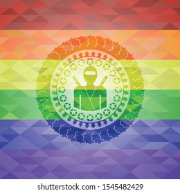 ninja icon inside emblem on mosaic background with the colors of the LGBT flag