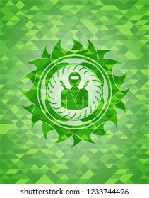 ninja icon inside green emblem with triangle mosaic background