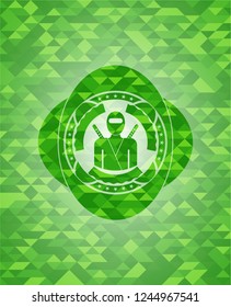ninja icon inside green emblem with mosaic ecological style background