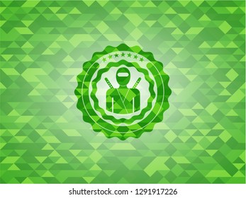 ninja icon inside green emblem with triangle mosaic background