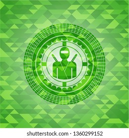 ninja icon inside green emblem with triangle mosaic background