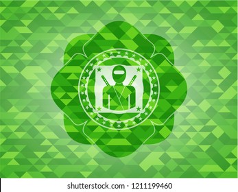 ninja icon inside green mosaic emblem