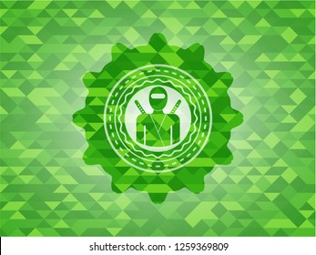 ninja icon inside green mosaic emblem