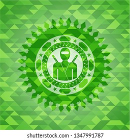 ninja icon inside green mosaic emblem