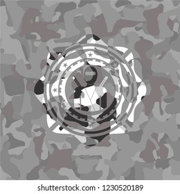 ninja icon inside grey camouflage emblem