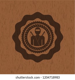 ninja icon inside realistic wood emblem