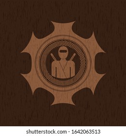 ninja icon inside realistic wood emblem