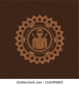 ninja icon inside retro style wooden emblem