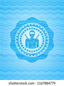 ninja icon inside sky blue water wave badge.