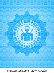 ninja icon inside sky blue water wave style emblem. 