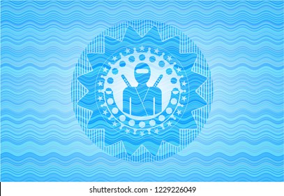 ninja icon inside water representation emblem.