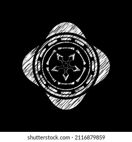icono de ninja star dibujado en un pizarrón. 