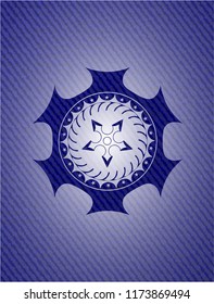 ninja star icon inside badge with denim background