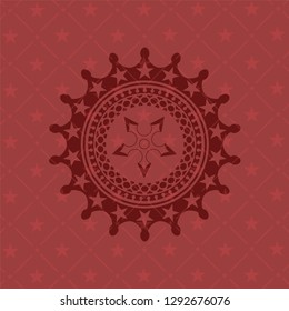 ninja star icon inside badge with red background