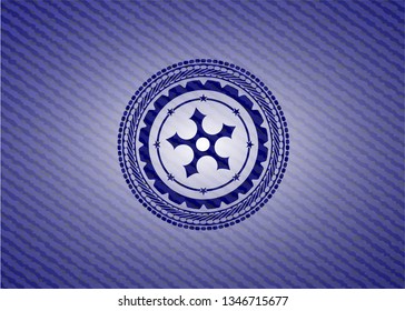 ninja star icon inside badge with denim background