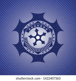 ninja star icon inside badge with denim texture