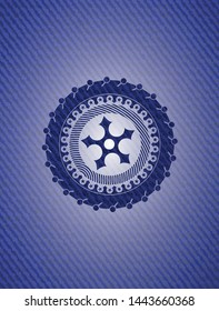 ninja star icon inside badge with denim background