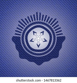 ninja star icon inside badge with denim texture