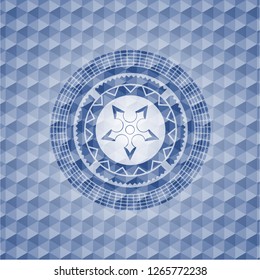 ninja star icon inside blue badge with geometric pattern background.