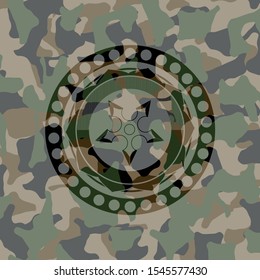 ninja star icon inside camouflaged emblem