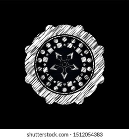 ninja star icon inside chalkboard emblem on black board