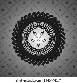 ninja star icon inside dark badge