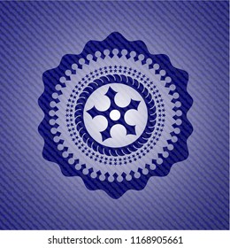 ninja star icon inside denim background