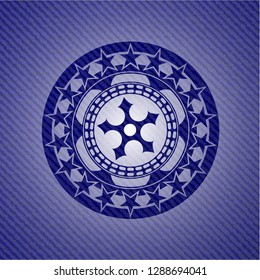 ninja star icon inside denim background