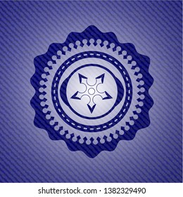 ninja star icon inside denim background