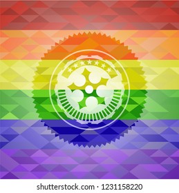 ninja star icon inside emblem on mosaic background with the colors of the LGBT flag