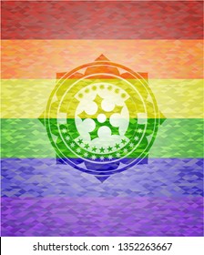 ninja star icon inside emblem on mosaic background with the colors of the LGBT flag