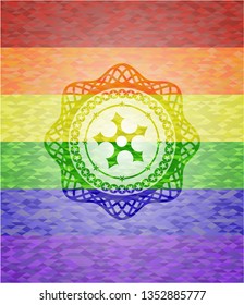ninja star icon inside emblem on mosaic background with the colors of the LGBT flag