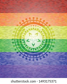 ninja star icon inside emblem on mosaic background with the colors of the LGBT flag