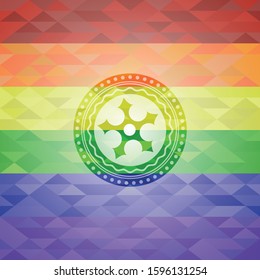 ninja star icon inside emblem on mosaic background with the colors of the LGBT flag