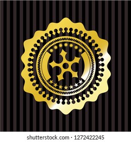 ninja star icon inside gold badge or emblem