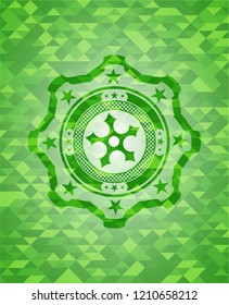 ninja star icon inside green emblem with mosaic background